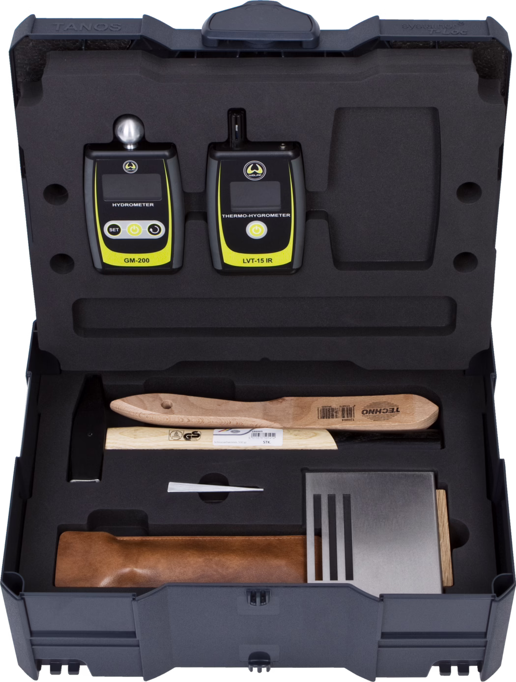 Top-down view of a hard foam-lined carrying case showing two handheld electronic instruments seated in custom foam cutouts: on the left a GM-200 hydrometer with a small metal probe ball and the label 'HYDROMETER', and on the right an LVT-15 IR thermo-hygrometer with an infrared sensor and the label 'THERMO-HYGROMETER'. Both devices are predominantly black with bright yellow accent panels, small LCD screens and simple control buttons. The surrounding foam insert holds additional tools and accessories including wooden-handled tools, a small metal wedge, a rectangular metal plate with ventilation-like slots and a brown leather pouch; each item sits in a molded compartment that protects and organizes the kit for transport. The composition highlights the orderly layout, contrasting textures of foam, plastic, wood and metal, and clear product labeling.